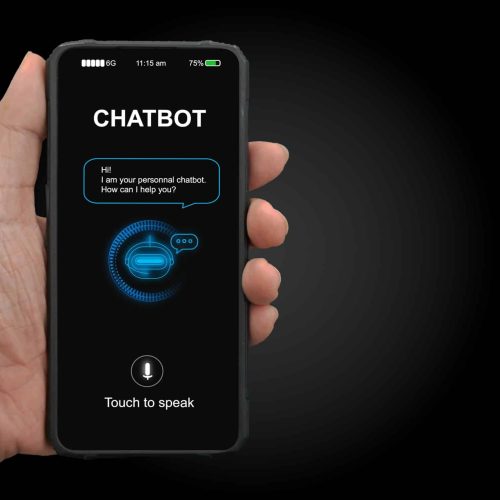 A man's hand holding mobile smartphone with chatterbot application